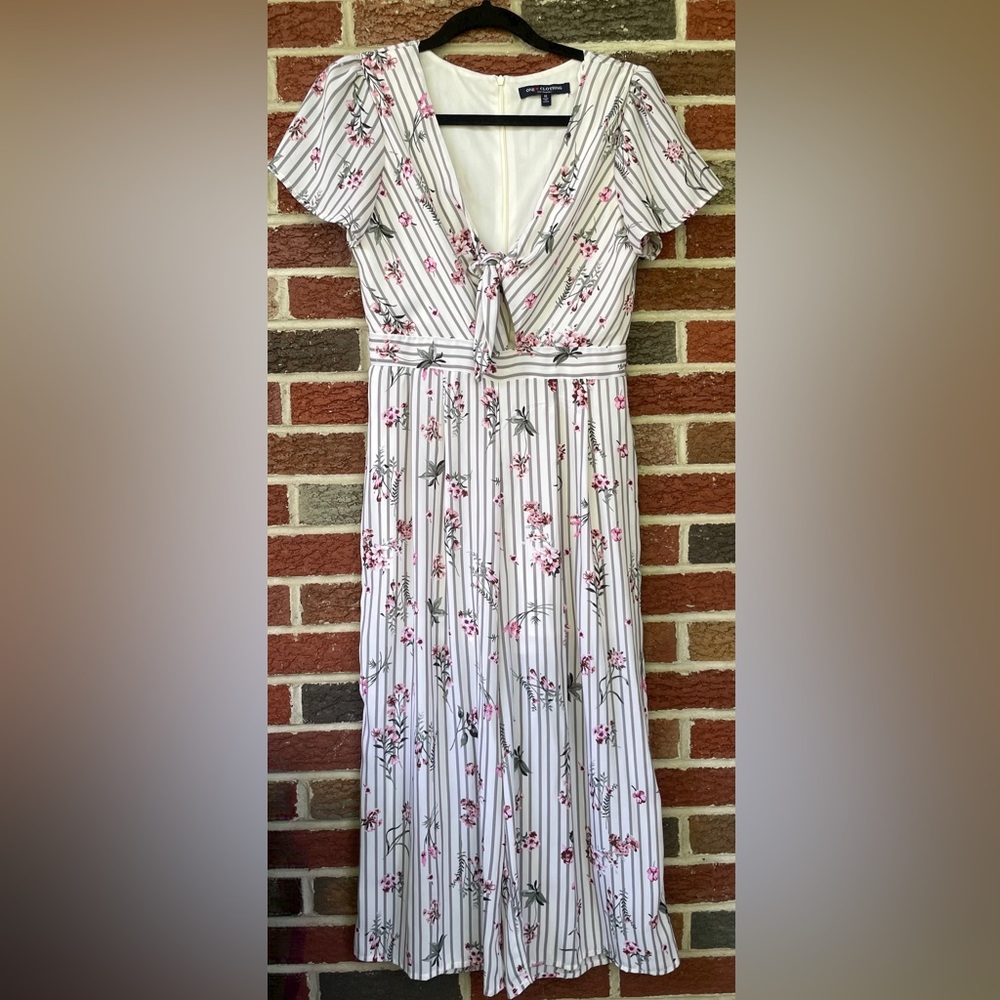 LIKE NEW- Striped and floral jumpsuit with a tie in the middle. Small